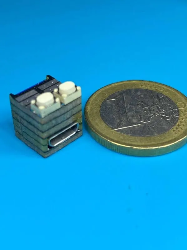 The 10 mm ESP32 cube next to a 1 € coin