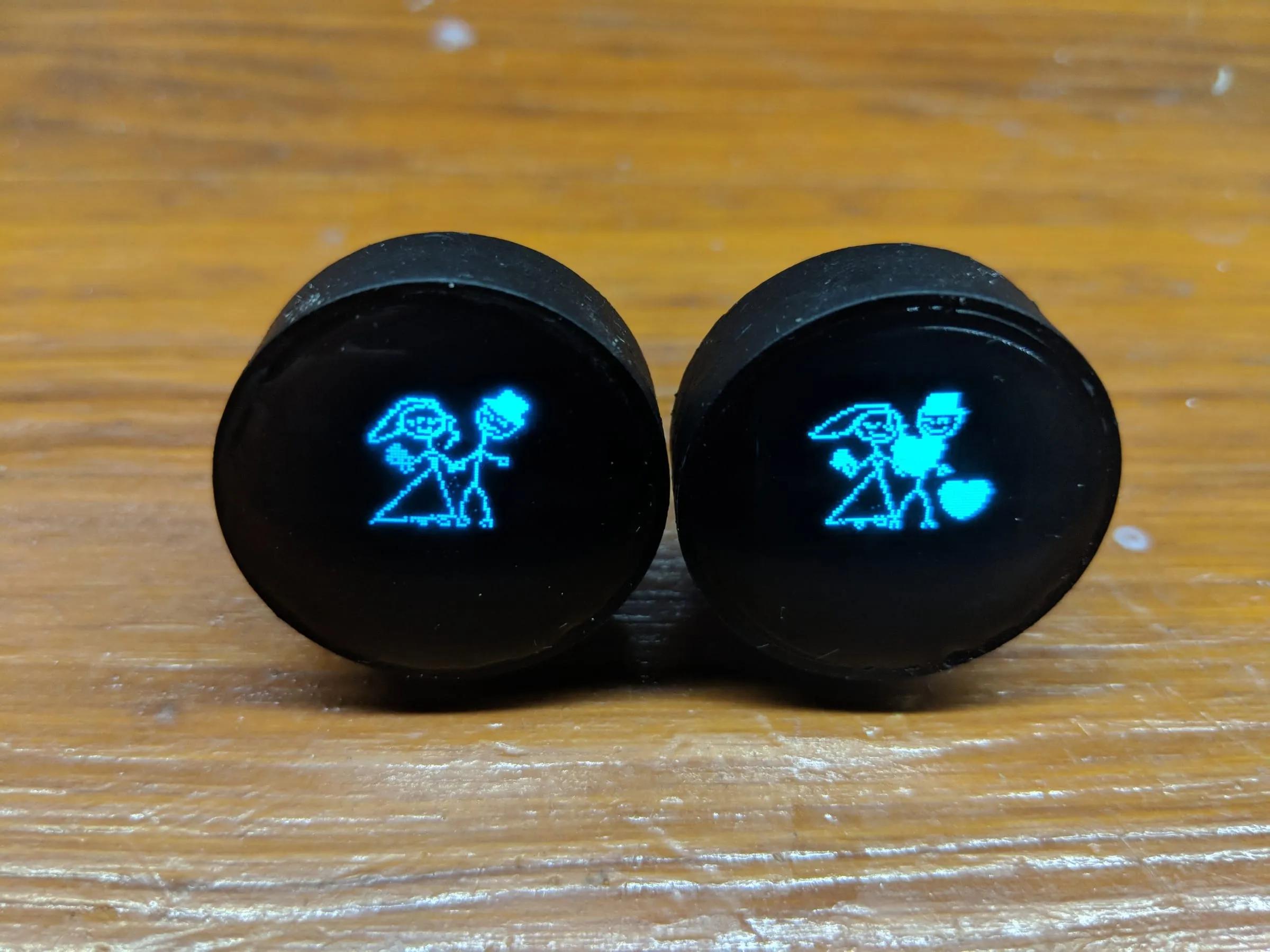 Another view of the cufflinks displaying pixel art