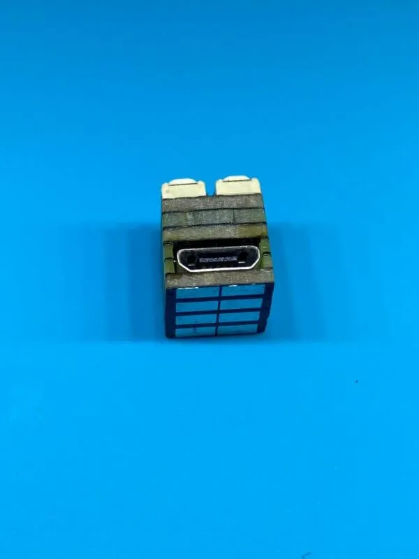 The micro-USB side of the cube