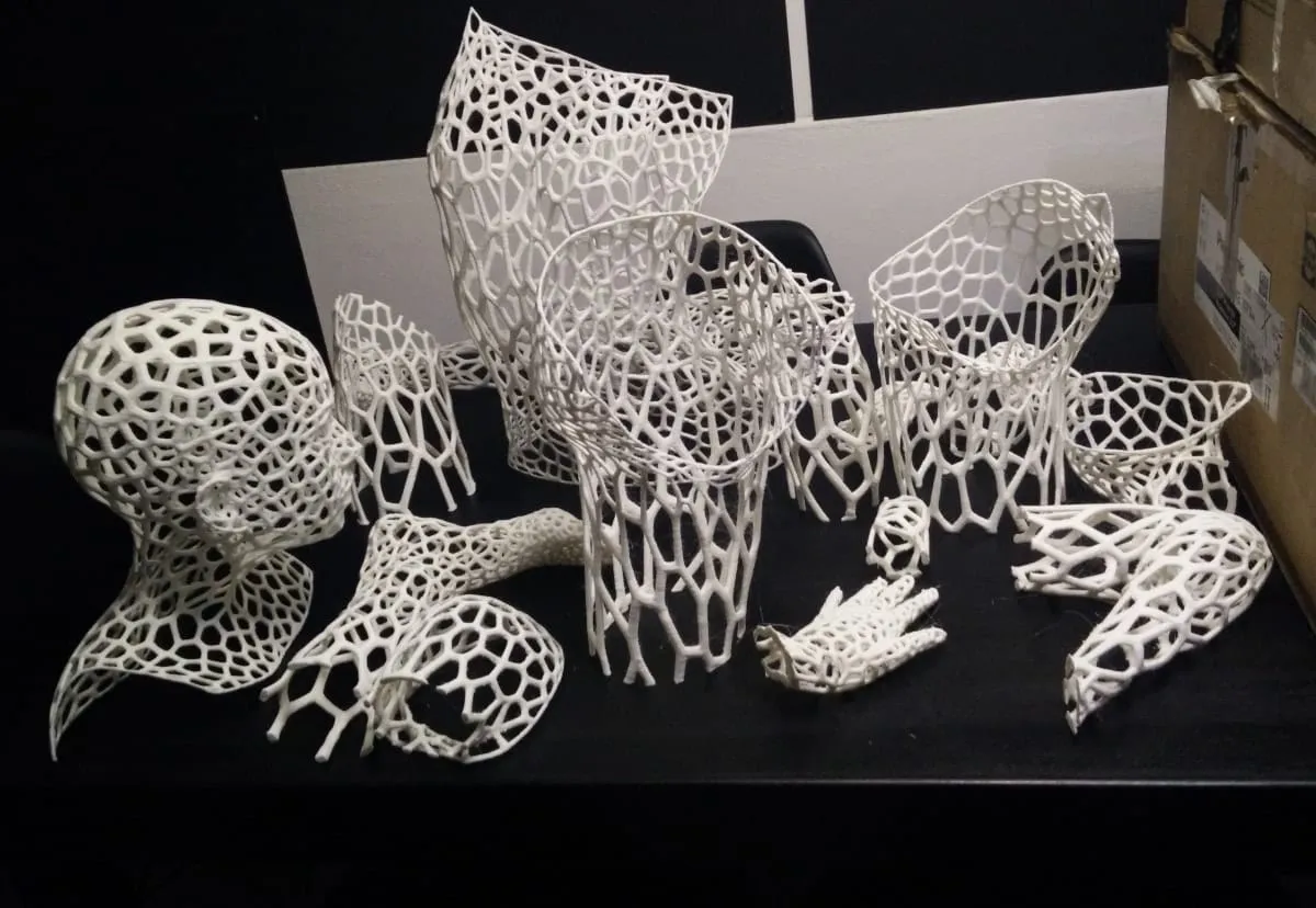 Printed lattice body parts laid out before assembly