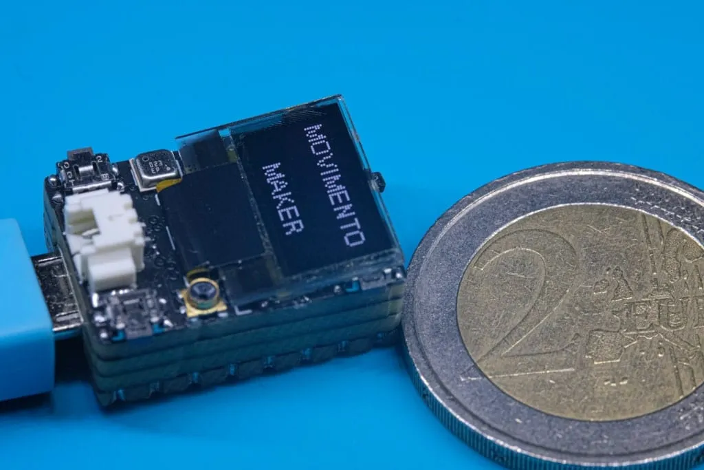 Next to a 2 € coin for scale